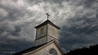 Mørke skyer over Mandal Kirke